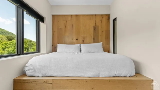 a view of a balcony with chair and wooden floor