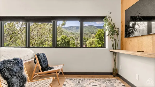a white bath tub sitting next to a white sink and a shower