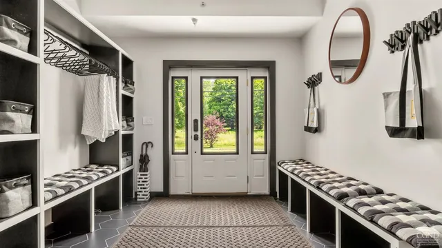 a kitchen with stainless steel appliances granite countertop a stove a refrigerator and a wooden cabinets