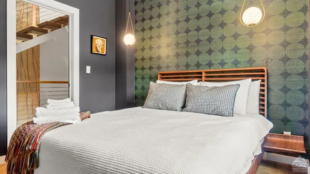 a bedroom with a bed and window