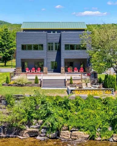 a view of a patio with table and chairs and a potted plant