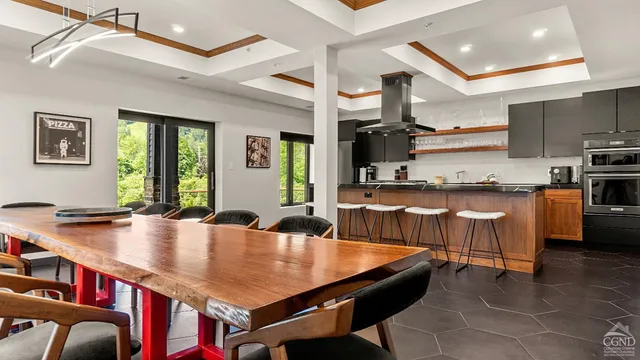 a kitchen with stainless steel appliances granite countertop a sink and a refrigerator
