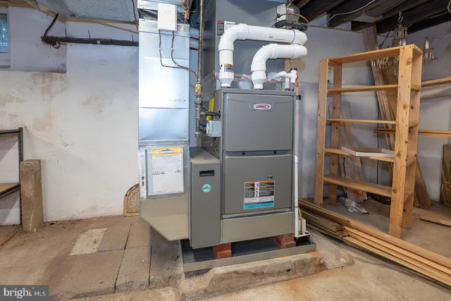 a room with water heater and racks