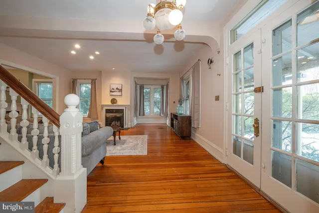 a lobby with furniture and wooden floor