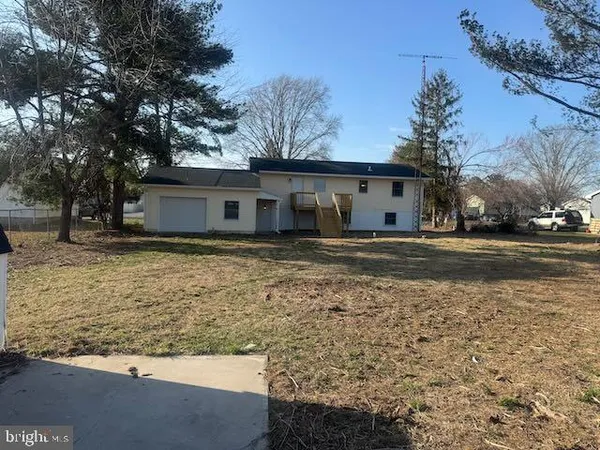 a view of a house with a snow in the yard