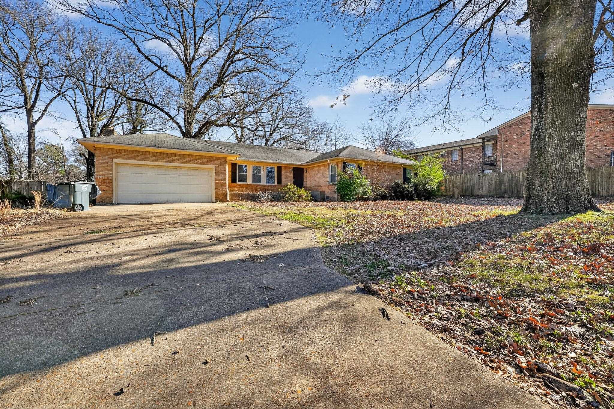4094 Auburn Road Memphis, TN 38116 - Photo 2 of 30 Ranch-style home featuring driveway, brick siding, and an attached garage