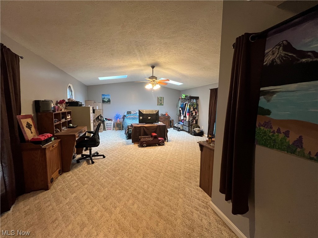 1012 Dugan Road Belpre, OH 45714 - Photo 18 of 29 Carpeted bedroom featuring a textured ceiling and ceiling fan