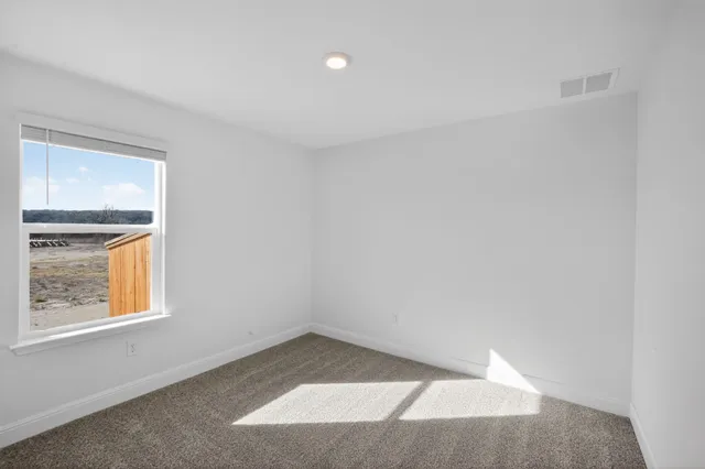 an empty room with windows