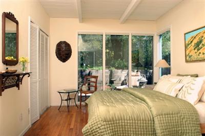 30 Millard Road Larkspur, CA 94939 - Photo 6 of 11 Master bedroom looks out onto the patio area and landscaped back lawn and gardens.