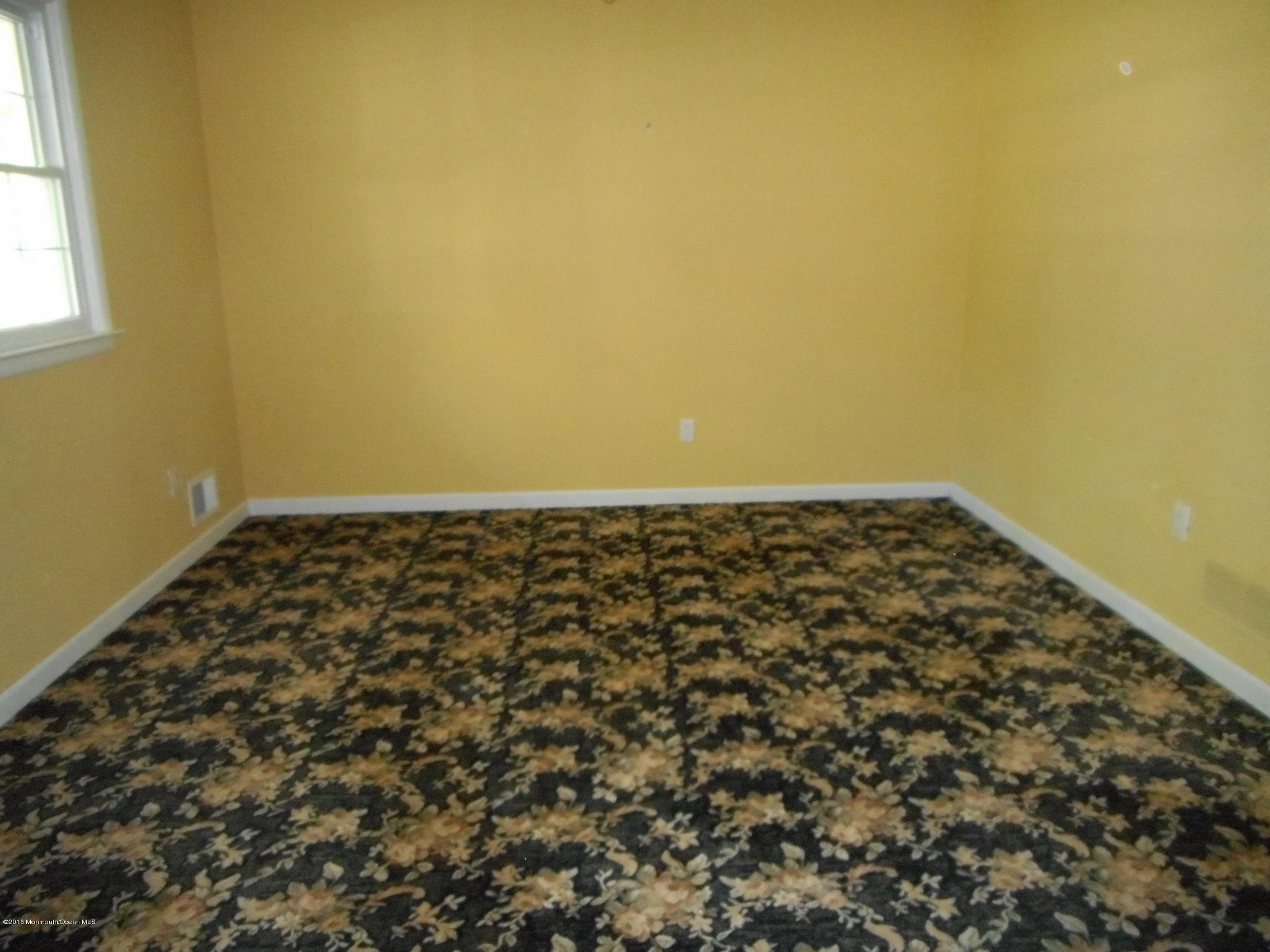 104 Bar Harbor Road Freehold, NJ 07728 - Photo 14 of 18 an empty room with a window