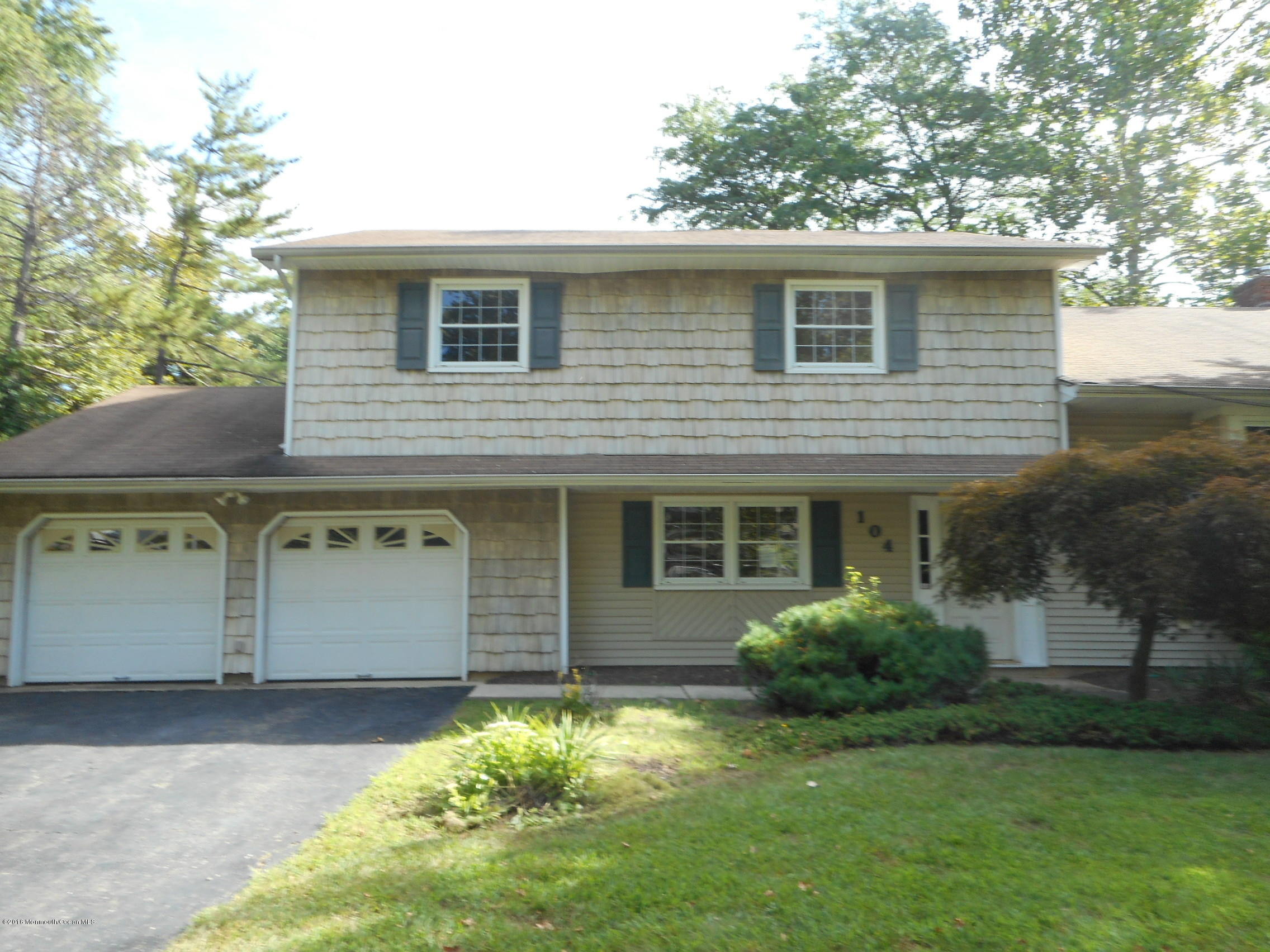 104 Bar Harbor Road Freehold, NJ 07728 - Photo 3 of 18 a front view of a house with a yard