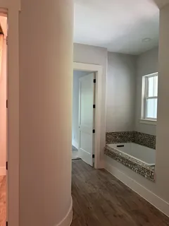 a bathroom with a bathtub and a sink
