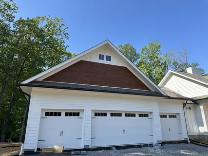 a house with trees in the background
