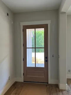 a view of entryway with wooden floor