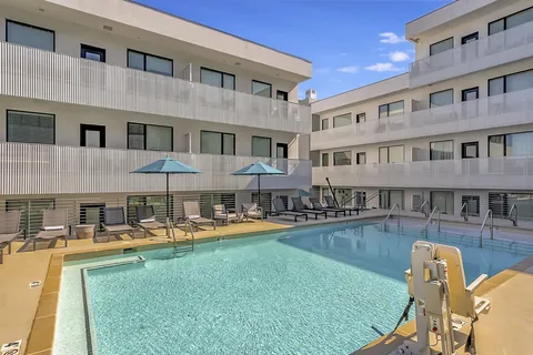 a front view of building with outdoor seating