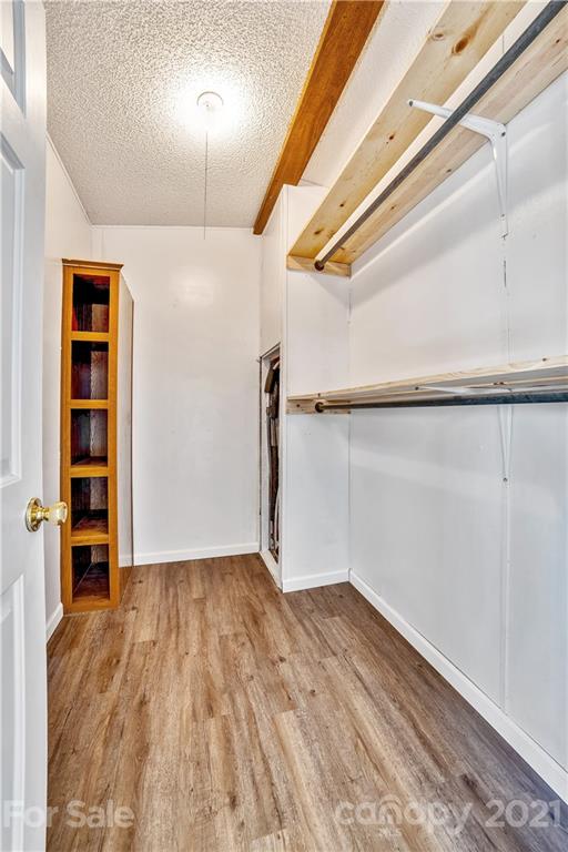 404 Rutledge Road Mount Holly, NC 28120 - Photo 23 of 40 a view of empty room with wooden floor
