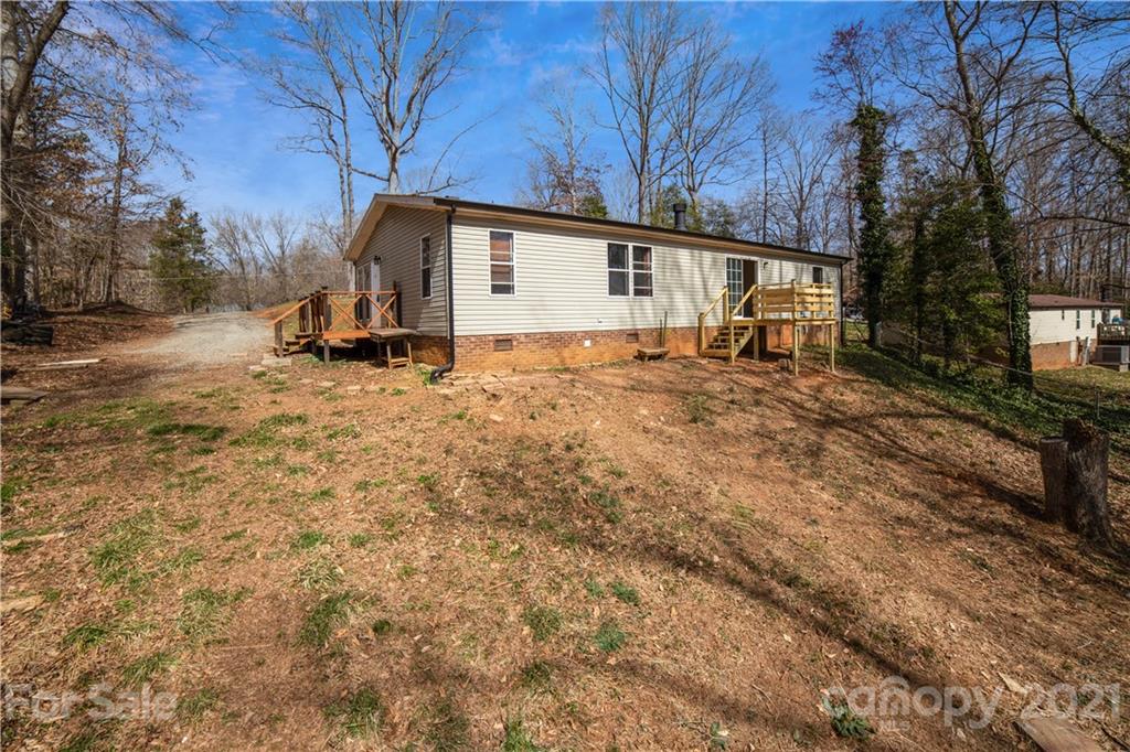 404 Rutledge Road Mount Holly, NC 28120 - Photo 29 of 40 a view of a house with a yard covered in snow