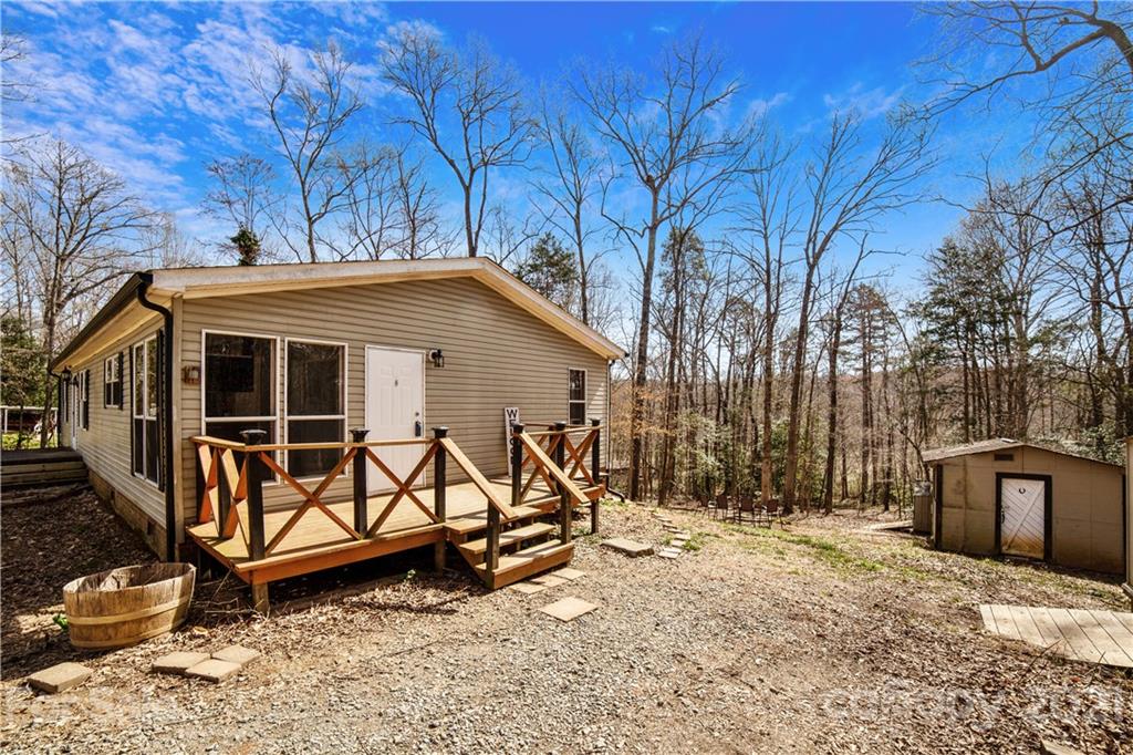 404 Rutledge Road Mount Holly, NC 28120 - Photo 4 of 40 a view of a house with wooden fence next to a road