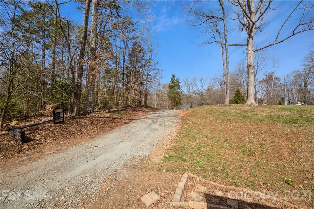 404 Rutledge Road Mount Holly, NC 28120 - Photo 31 of 40 a view of a yard with trees
