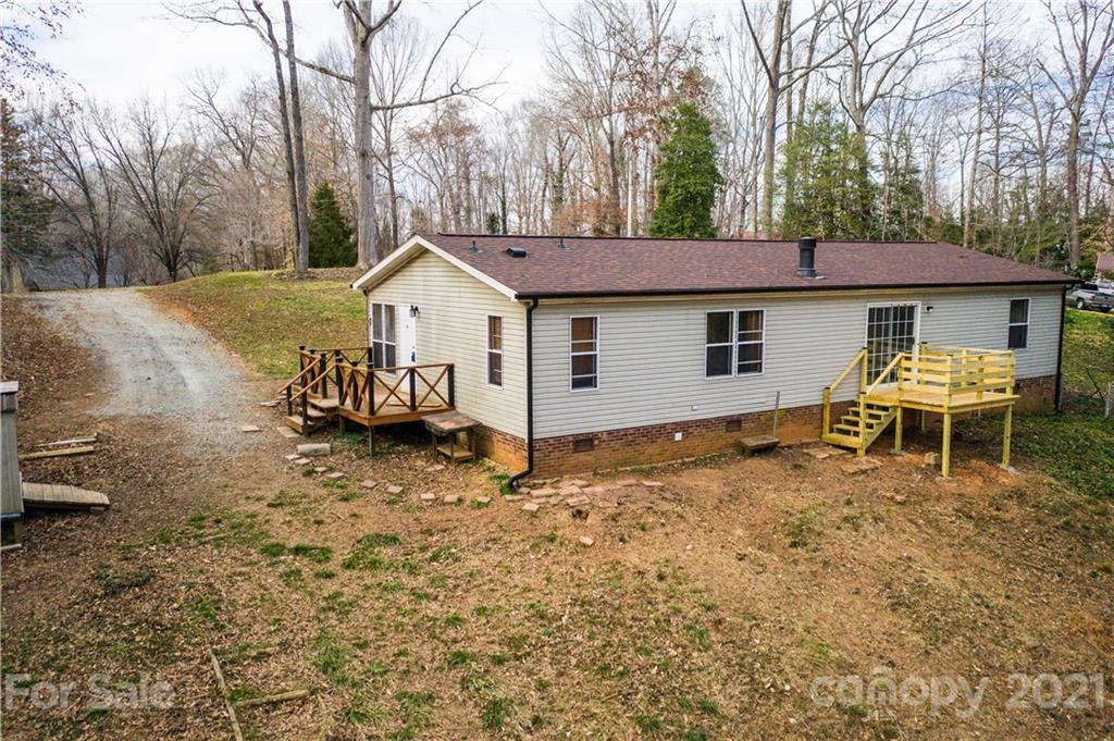 404 Rutledge Road Mount Holly, NC 28120 - Photo 40 of 40 a view of a house with a yard and sitting area