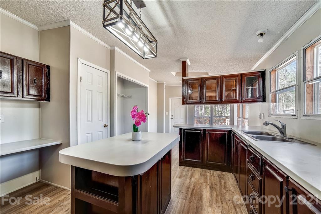 404 Rutledge Road Mount Holly, NC 28120 - Photo 6 of 40 a kitchen that has a lot of cabinets in it
