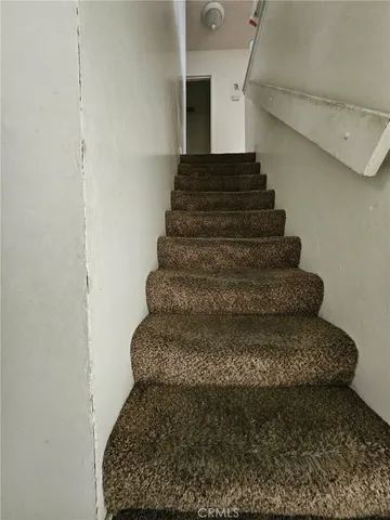 a bathroom with a sink toilet and mirror