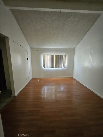 a view of a livingroom with an oven and dryer