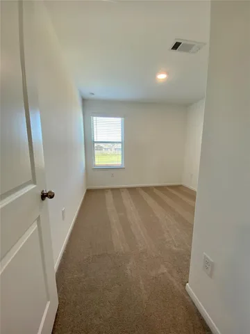 an entryway of a room with windows