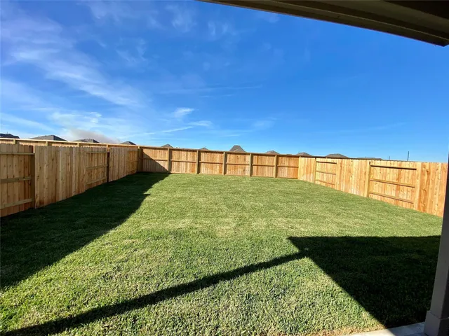 a view of swimming pool with a yard