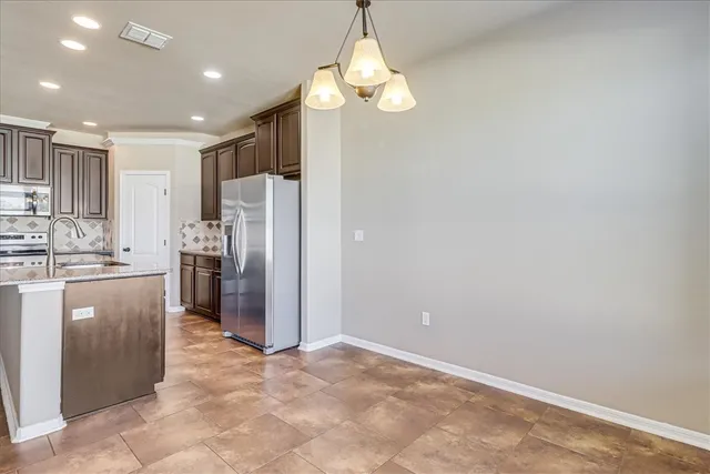 a view of a kitchen with a sink