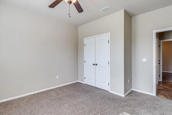 an empty room with a empty space and windows