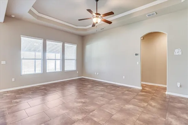 a view of an empty room with a window