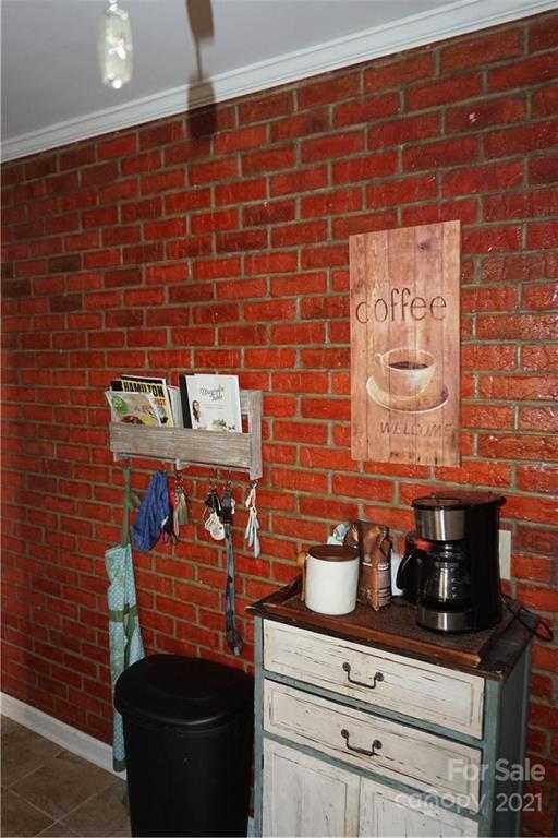 10441 Rockwood Road Charlotte, NC 28215 - Photo 18 of 45 a view of a fireplace with wooden cabinets