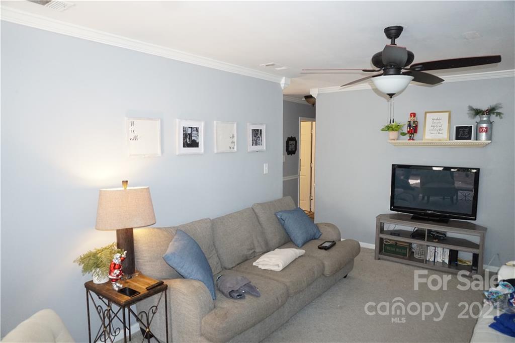 10441 Rockwood Road Charlotte, NC 28215 - Photo 21 of 45 a living room with furniture and a flat screen tv