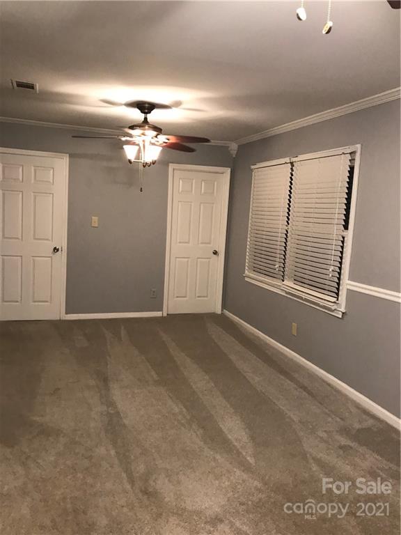 10441 Rockwood Road Charlotte, NC 28215 - Photo 22 of 45 a view of an empty room with a window