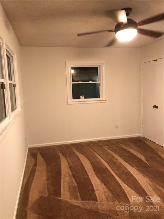 10441 Rockwood Road Charlotte, NC 28215 - Photo 30 of 45 a view of room with window and ceiling fan