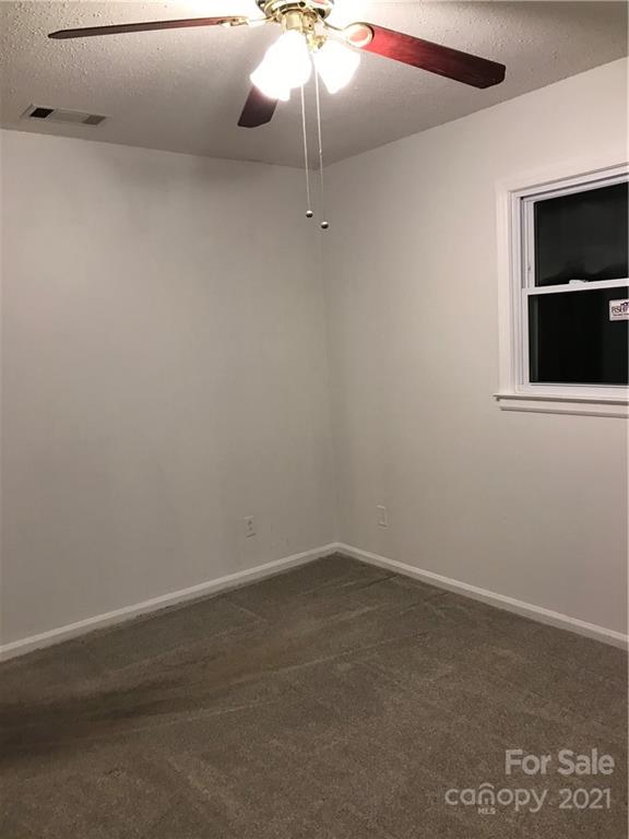 10441 Rockwood Road Charlotte, NC 28215 - Photo 34 of 45 a room with a fan and dryer