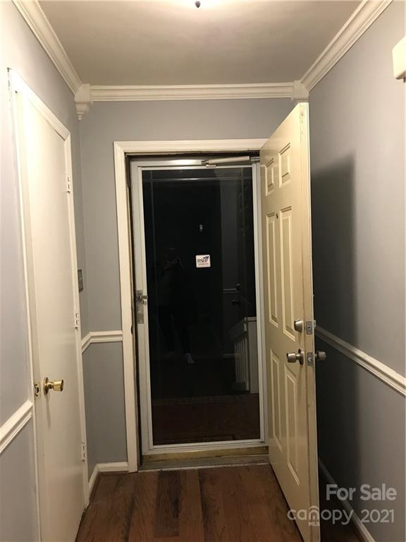 10441 Rockwood Road Charlotte, NC 28215 - Photo 40 of 45 a view of a hallway with wooden floor and staircase