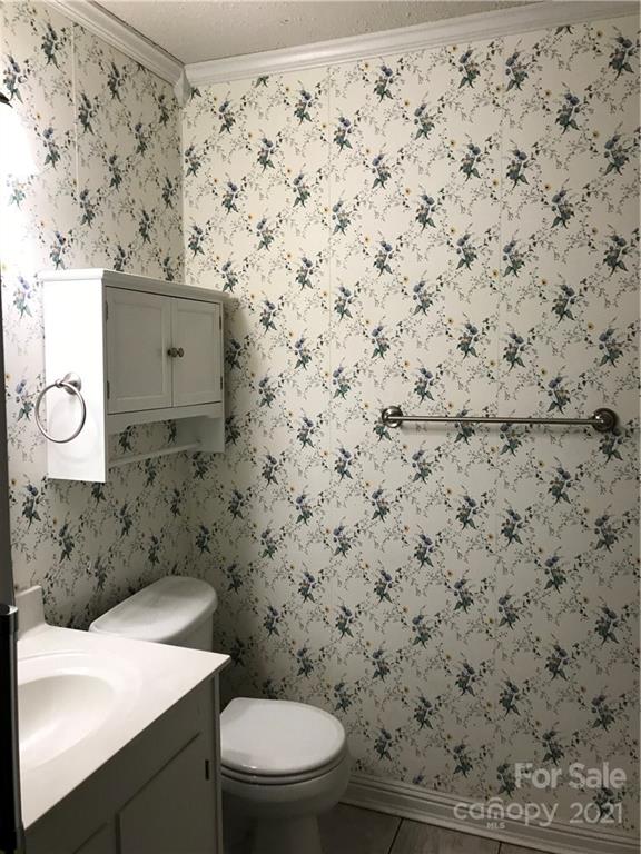 10441 Rockwood Road Charlotte, NC 28215 - Photo 43 of 45 a bathroom with a toilet and a sink