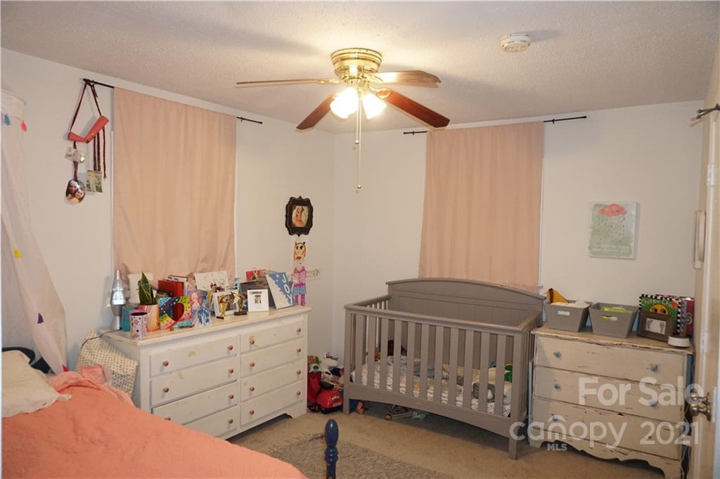 10441 Rockwood Road Charlotte, NC 28215 - Photo 45 of 45 a bedroom with furniture and baby crib