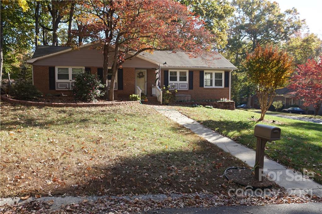 10441 Rockwood Road Charlotte, NC 28215 - Photo 9 of 45 a front view of a house with a yard and porch