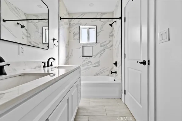 a bathroom with a sink and a bathtub