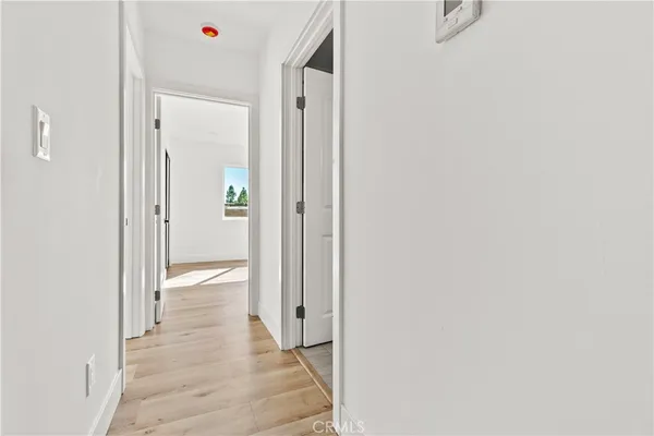 a view of a bathroom from a hallway