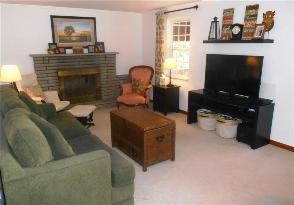 2068 Rockfield Road Pittsburgh, PA 15243 - Photo 2 of 25 Spacious living room with log burning fireplace.