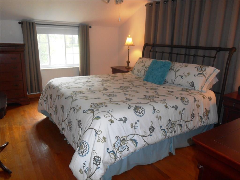 2068 Rockfield Road Pittsburgh, PA 15243 - Photo 15 of 25 The master bedroom can hold a king sized bed comfortably. It also has a ceiling fan and hardwood floors.