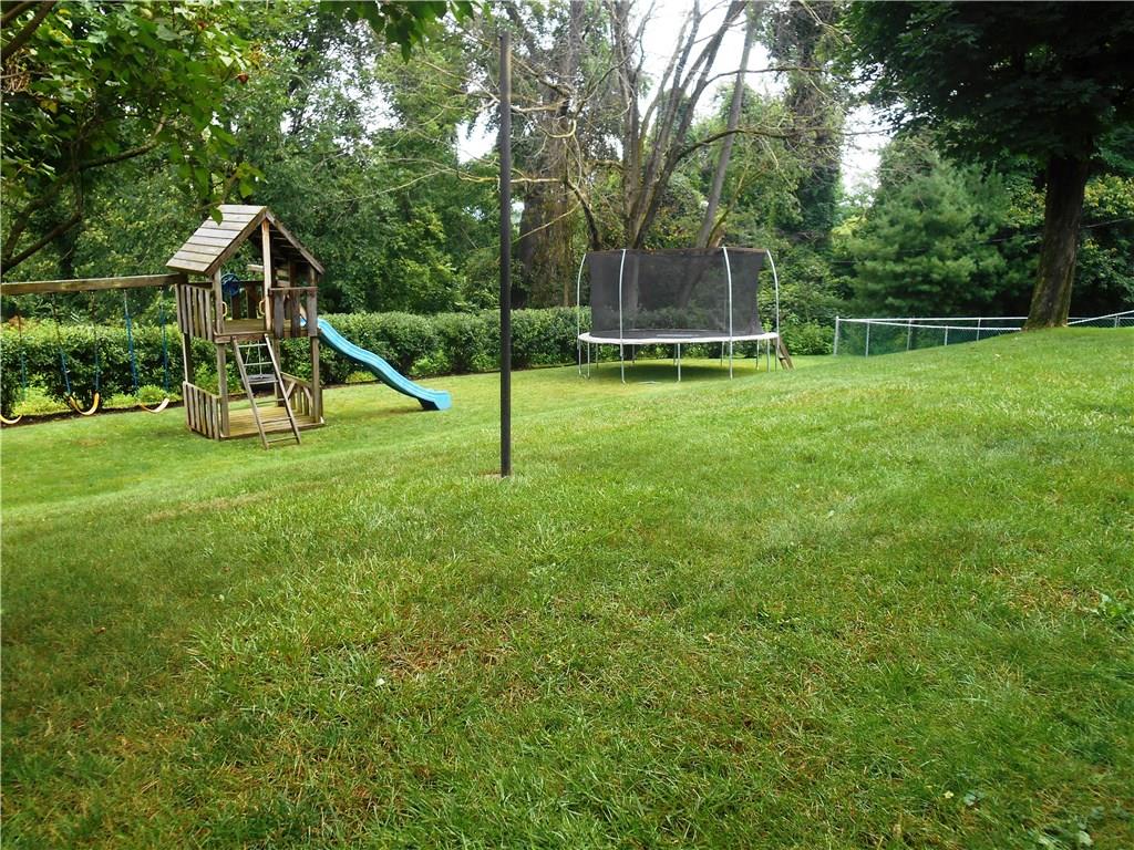 2068 Rockfield Road Pittsburgh, PA 15243 - Photo 23 of 25 Small grade in the yard that levels off into two large areas. The swing set is included in this sale.