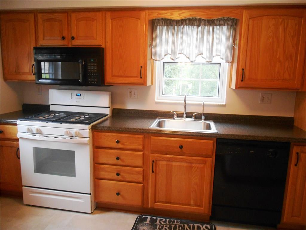 2068 Rockfield Road Pittsburgh, PA 15243 - Photo 7 of 25 The galley style kitchen with newer microwave and dishwasher.
