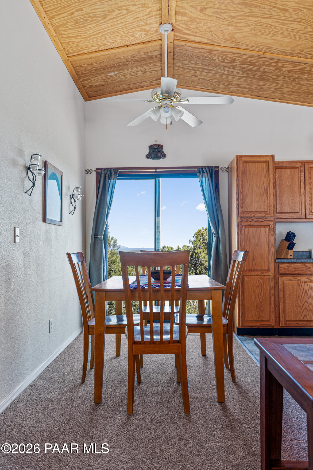 33749 West Whiskey River Road, Unit 21 Seligman, AZ 86337 - Photo 16 of 41 a view of a dining room with furniture window and wooden floor