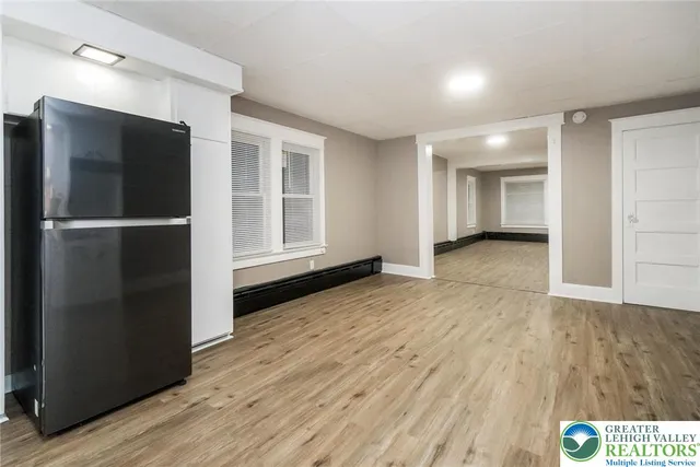a kitchen with granite countertop a sink and cabinets