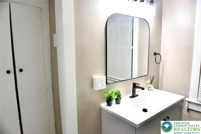 a bathroom with a bathtub and a sink